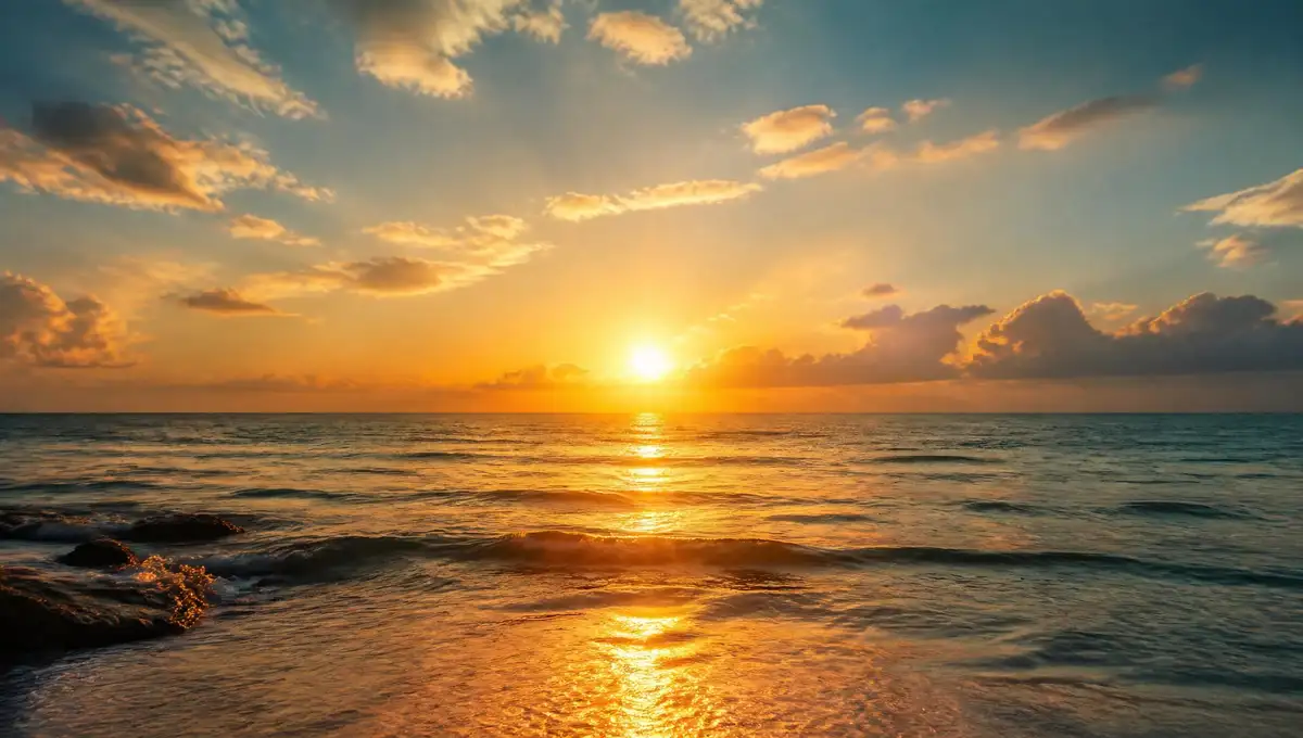 Golden sun shining over a calm ocean horizon